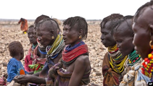 Turkana women wait for food relief at Kalok Tonyang in the Turkana district northwest of Nairobi, August 9, 2011