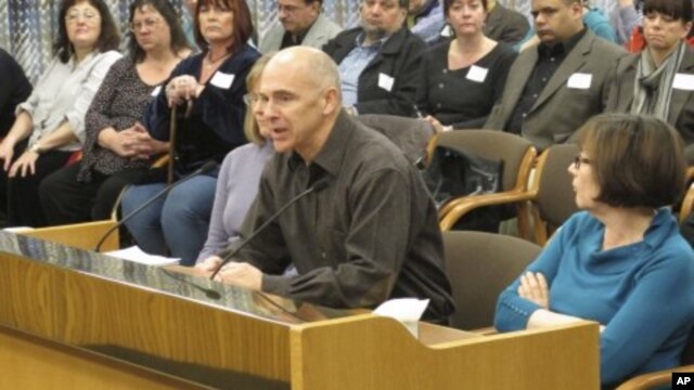 Tim Collette of Bend, Ore., tells state lawmakers about his experience working with a bank on a loan modification in Salem, Oregon, February 6, 2012.