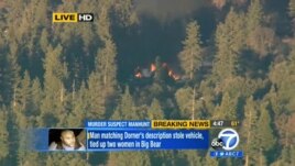 Image taken from video provided by KABC-TV, the cabin in Big Bear, Calif. where ex-Los Angeles police officer Christopher Dorner is believed to be barricaded inside is in flames Tuesday, Feb. 12, 2013.