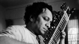 In this 1967 file photo, Ravi Shankar plays his sitar in Los Angeles, California.
