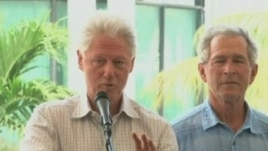 Former presidents Bill Clinton and George Bush speak at donor's conference for Haiti reconstruction aid.