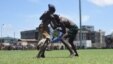 Two wrestlers grapple at the "Wrestling for Peace" tournament at Juba Stadium in South Sudan's capital, April 16, 2016. (J. Patinkin/VOA)