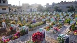 Yon simityè pou viktim fòs prezidan Bashar al-Assad yo, 17 fevriye 2013 (Lens Young Homsi)
