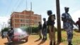 Policemen stand guard outside the Daily Monitor newspaper's offices in Kampala on May 20, 2013