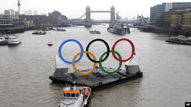 Backdropped by the historic Tower Bridge, a giant Olympic Rings floats on the River Thames in London in the run-up for the Olympic games, during its launch to mark 150-days until the start of the London 2012 Olympic games, February 28, 2012. 