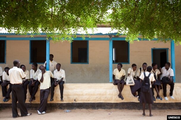 FILE - Students take a break at Supiri Secondary School in Juba, South Sudan. The school is mixed boys and girls. Some women's rights activists believe that only through educating girls will sexual violence in South Sudan end. (UNESCO/B. Desrus)