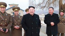 North Korean leader Kim Jong Un, center, in an undated photo released by North Korea.