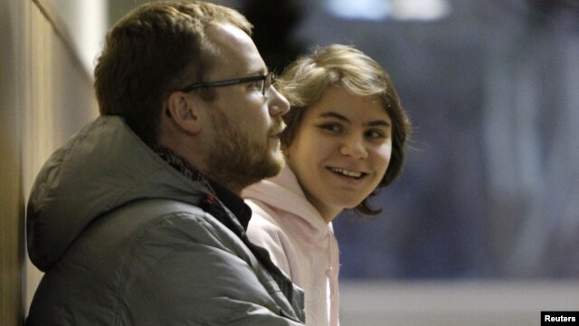 Yekaterina Samutsevich, the member of Pussy Riot who was released from jail after her sentence was suspended on appeal, waits during a court hearing in Moscow November 20, 2012.  