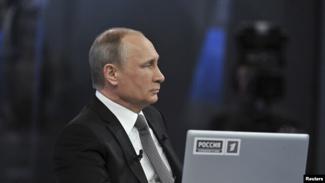 Russian President Vladimir Putin takes part in a live broadcast nationwide call-in in Moscow, April 16, 2015.