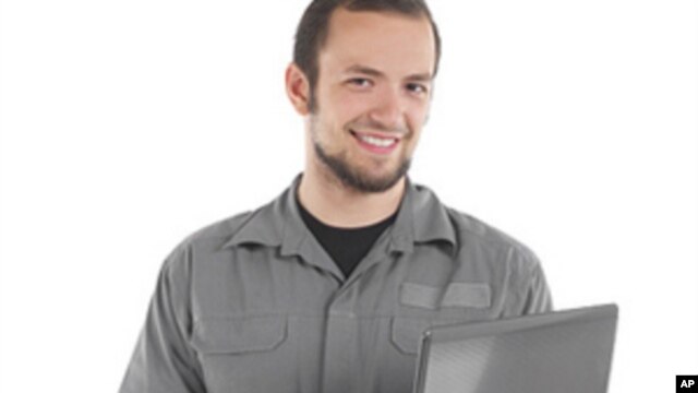 This young worker had better be checking his retirement account on that computer if he wants to be comfortable at age 65