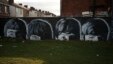 FILE - A mural of the Beatles is seen painted on the end of a row of terraced houses in Liverpool, northern England, Feb. 18, 2015. 