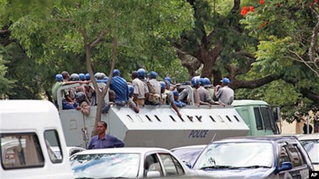 Armed Zimbabwean police patrol the streets of Harare in an effort to thwart a call for mass protests posted on Zimbabwean websites against the longtime authoritarian ruler, President Robert Mugabe, March 1, 2011