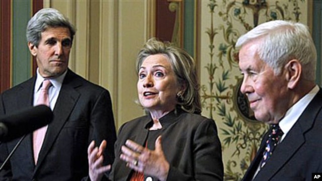 Secretary of State Hillary Rodham Clinton, center, flanked by Sen. John Kerry, D-Mass., left, and Sen. Richard Lugar, R-Ind., talks about the START Treaty following their meeting on Capitol Hill in Washington, 17 Nov 2010