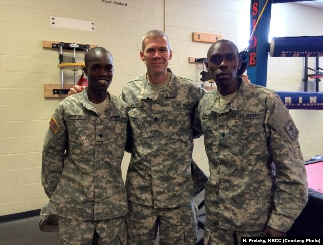 Soldiers and 2016 track and field Olympians, from left, Spc. Shadrack Kipchirchir, Staff Sgt. John Nunn and Spc. Paul Chelimo pose in Fort Carson’s boxing training room, nicknamed “The House of Pain.”