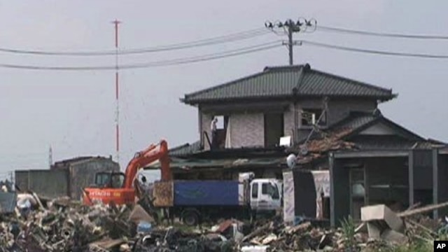 In Miyagi Prefecture alone, authorities estimate they will collect around 18 million metric tons of debris.  Workers continue clearing debris in July, 2011