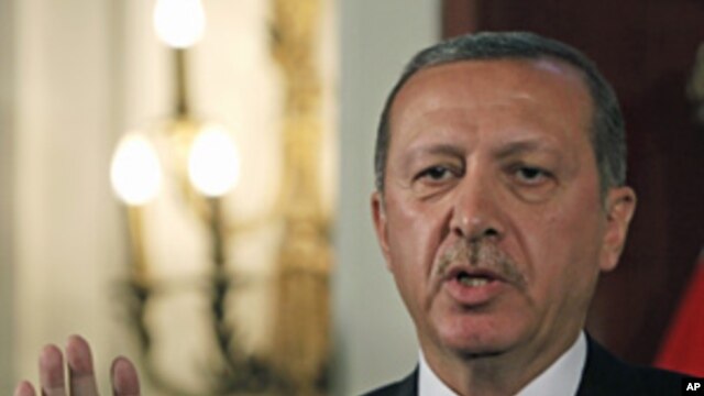 Turkey's Prime Minister Recep Tayyip Erdogan during a joint press conference with Egyptian Prime minister Essam Sharaf, unseen, in Cairo,  Sept. 13, 2011