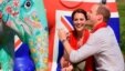 Britain's Prince William decorates an Elephant Parade statue as his wife Catherine, the Duchess of Cambridge, laughs during a visit to the Mark Shand Foundation at Kaziranga in the northeastern state of Assam, India, April 13, 2016.