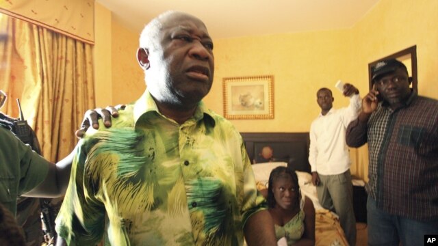 Ivorian strongman Laurent Gbagbo, left, and his wife Simone, are seen is the custody of republican forces loyal to election winner Alassane Ouattara at the Golf Hotel in Abidjan, Ivory Coast, April 11, 2011. 