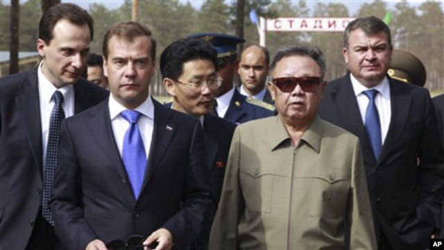 North Korean leader Kim Jong Il, second right, and Russian President Dmitry Medvedev, second left, during a meeting an a military garrison, outside Ulan-Ude, Wednesday, Aug. 24, 2011