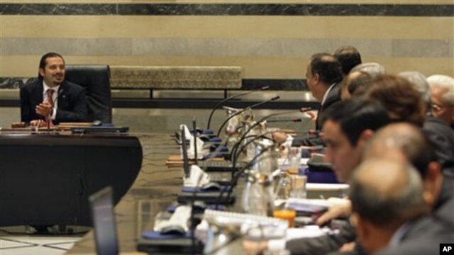 Lebanese Prime Minister Saad Hariri, left, is seen during a Cabinet meeting at the Government House in Beirut, Lebanon, 23 Sep 2010
