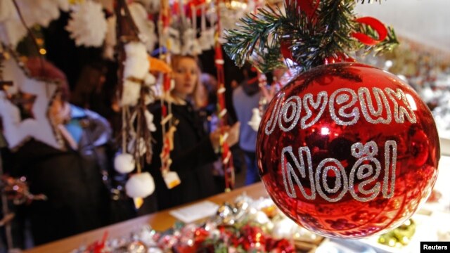 Christmas tree decorations are sold at the Christkindelsmaerik near Strasbourg Cathedral, Nov. 2012.