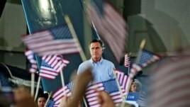 Republican presidential nominee, former Massachusetts Governor Mitt Romney addresses the audience at a rally with the GOP team at the Military Aviation Museum in Virginia Beach, Virginia, September 8, 2012.