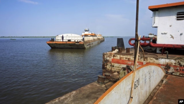 A barge with food and other imports arrives at the Nile port of Kosti at White Nile State, South Sudan, September 21, 2011.
