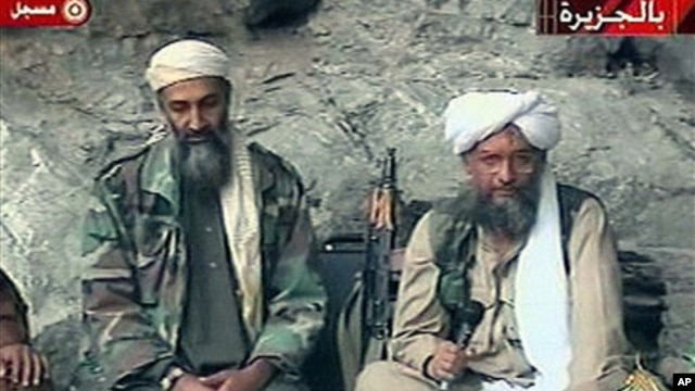 Osama bin Laden, left, and his top lieutenant, Egyptian Ayman al-Zawahri, right, are seen at an undisclosed location in this TV image broadcast, October 2001 (file photo)