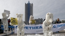 Greenpeace activists dressed as polar bears protest outside Gazprom's headquarters in Moscow, September 5, 2012. 