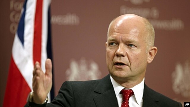 British Foreign Minister William Hague address the media during a news conference at the Foreign and Commonwealth Office in London, July 27, 2011