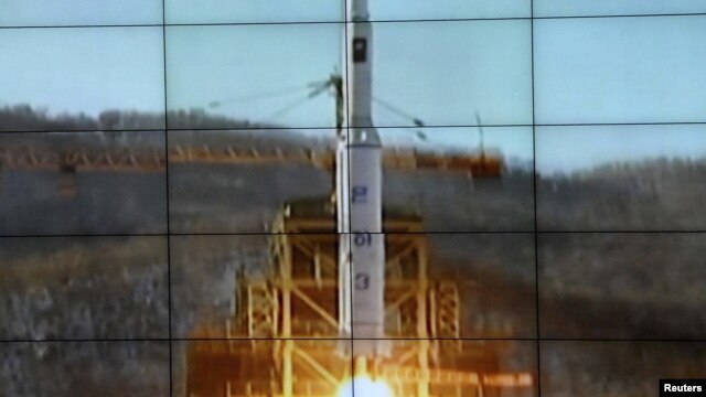 A screen shows the Unha-3 [Milky Way 3] rocket being launched from a launch pad at the West Sea Satellite Launch Site, at North Korea's satellite control centre in Cholsan county, North Pyongan province in this picture released by the official KCNA news a