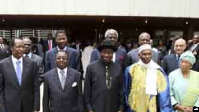 Heads of state and members of the Economic Community Of West African States (ECOWAS) pose for a photograph after attending the 39th ECOWAS Summit in Nigeria's capital Abuja March 23, 2011