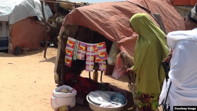 A small, woman-run store at the Hidaya Camp, on the outskirts of Mogadishu, sells detergent, coffee, charcoal and candy. (Photo courtesy of Filsan Darman)  