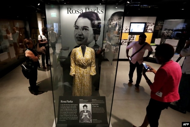 FILE - Civil Rights pioneer Rosa Parks' dress is on display in the concourse galleries at the Smithsonian's National Museum of African American History and Culture on the National Mall Sept. 14, 2016 in Washington, D.C.