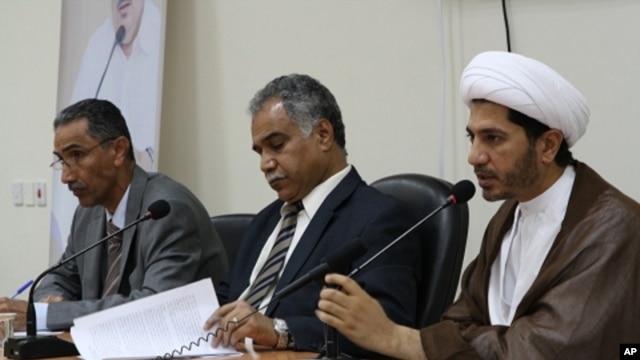 Opposition leaders (from left to right) Mahmood al-Rajab, Radhi Mohsen al-Mosawi and Sheikh Ali Salman speak at a joint press conference in Umm Al Hassam, Bahrain,  February 15, 2012.