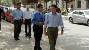 View of some members of the Iranian opposition resistance Mujahedeen-e- Khalq group, who have resettled in Albania from Iraq,  in a street, in Tirana, Albania,  Friday, May 17, 2013. The first exiles from an Iranian opposition group have moved to Albania 