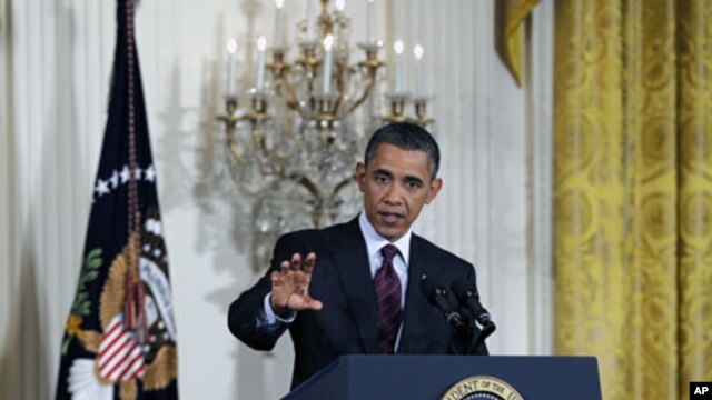 U.S. President Barack Obama answers a question during a news conference at the White House, June 29, 2011
