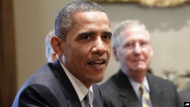 Senate Minority Leader Mitch McConnell of Ky. looks on at right, as President Barack Obama meets with Congressional leaders regarding the debt ceiling, Wednesday, July 13, 2011, in the White House in Washington.