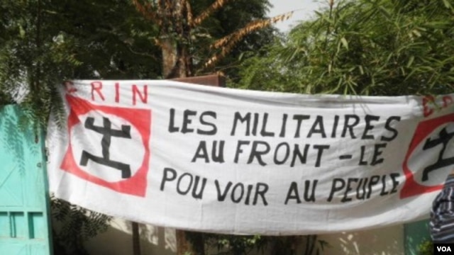 Sign at a demonstration against the coup d'etat, held on March 26 in Bamako, Mali. The sign reads, 'Military to the front lines, power to the people'.