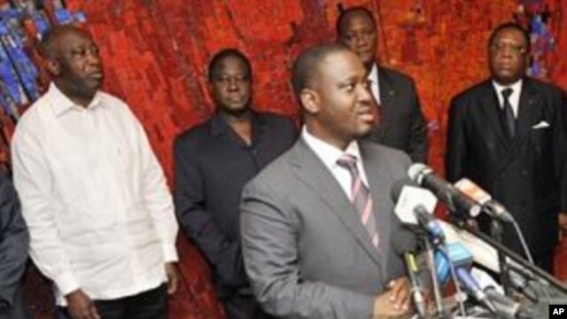 Ivory Coast's Prime Minister Guillaume Soro (C) speaks during a meeting with President Laurent Gbagbo (L) and party leaders at the presidential palace in Abidjan  ahead of a presidential poll on October 31, 2010, on 06 Sep 2010