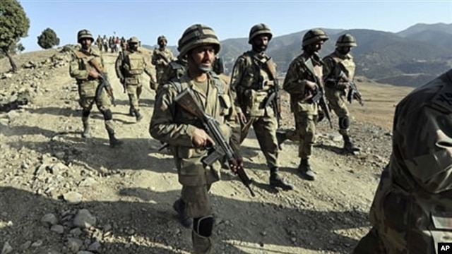 Pakistani troops patrol on a hill top post in Ladha, a town in the troubled tribal region of South Waziristan along the Afghan border, 17 Nov 2009