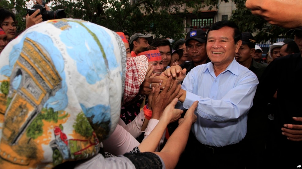 Cambodia National Rescue Party Deputy President Kem Sokha greets supporters during a rally in Phnom Penh, Cambodia, file photo. 