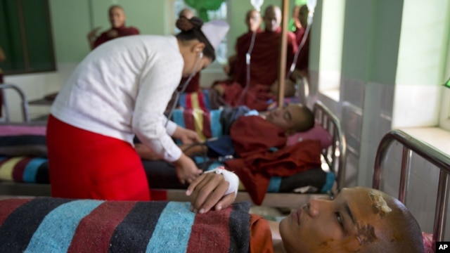 Buddhist monks are treated at a hospital in Monywa after a police crackdown on protesters at a controversial copper mine, Nov. 29, 2012.