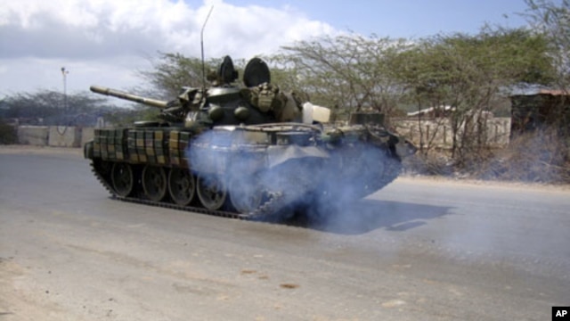African Union Mission to Somalia (AMISOM) peacekeepers patrol in their tanks along a main road in Hodan district in of the capital Mogadishu, Somalia, March 4, 2011