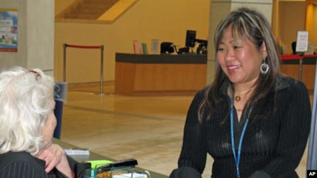 Leah Esguerra (right) is a full-time social worker assigned to work with the homeless who frequent the San Francisco Public Library.