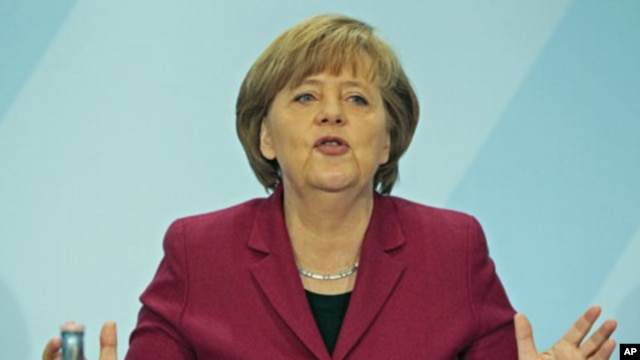 German Chancellor Angela Merkel speaks during a news conference in the Chancellery in Berlin, March 15, 2011