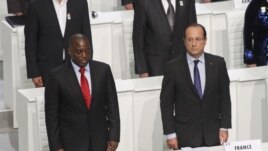 French President Francois Hollande and DRC President Joseph Kabila stand during the opening session of the Francophone Summit, in Kinshasa, DRC, Oct. 13, 2012. 