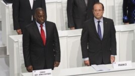French President Francois Hollande and DRC President Joseph Kabila stand during the opening session of the Francophone Summit, in Kinshasa, DRC, Oct. 13, 2012. 