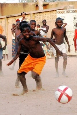 Children play in the street in Niger after receiving soccer balls from Project Play Africa. (Courtesy Project Play Africa)