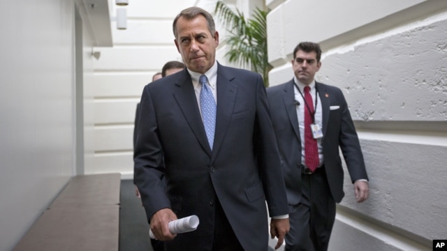 House Speaker John Boehner of Ohio walks to a closed-door Republican strategy session, Wednesday, Dec. 5, 2012, on Capitol Hill in Washington.